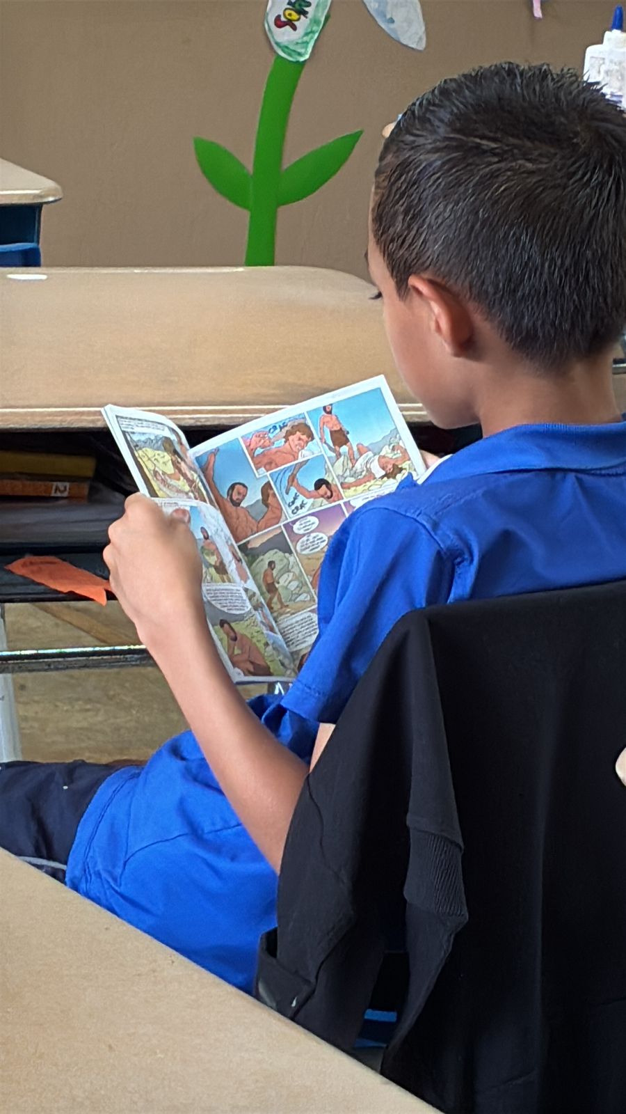 Student reading in classroom