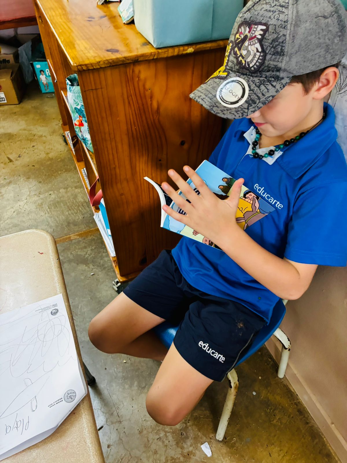 Child reading booklet