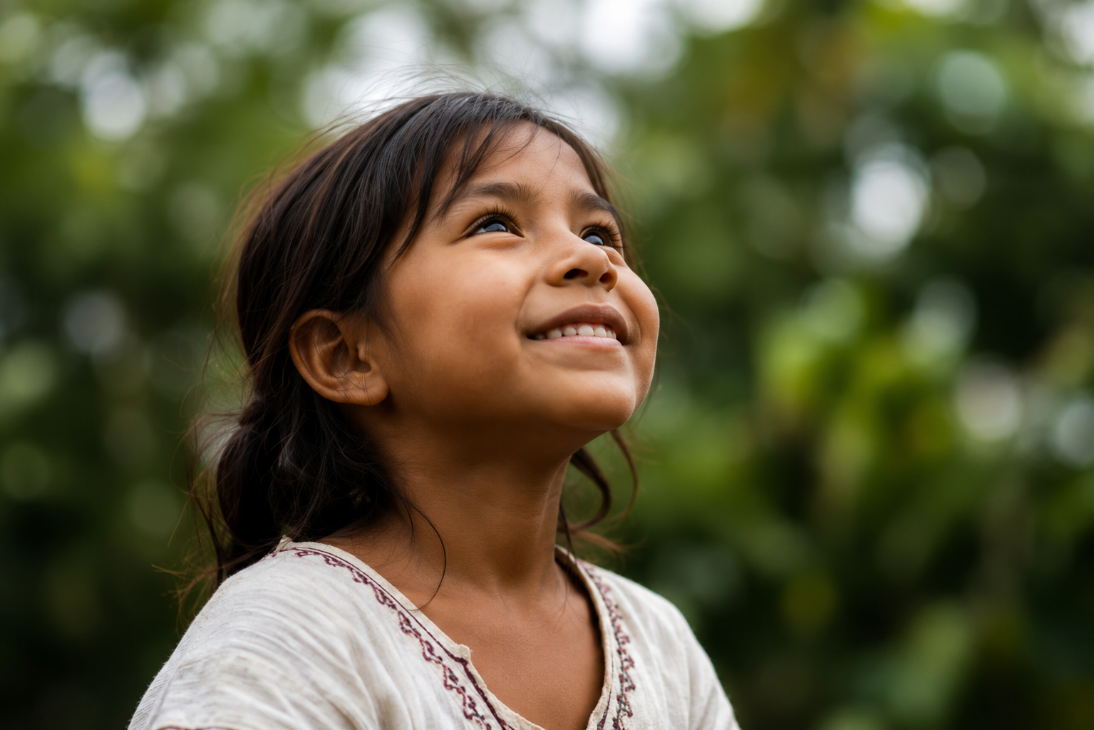 A child looking upward with hope